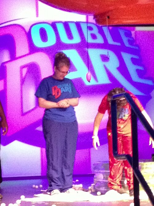 contestants competing on a Double Dare obstacle course